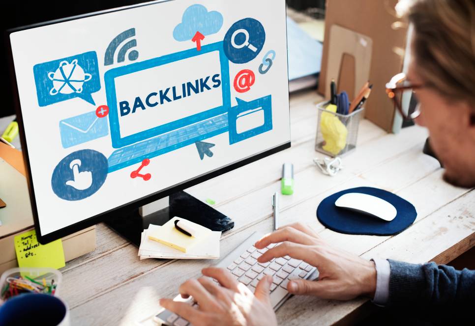 person working on laptop with SEO written on the screen